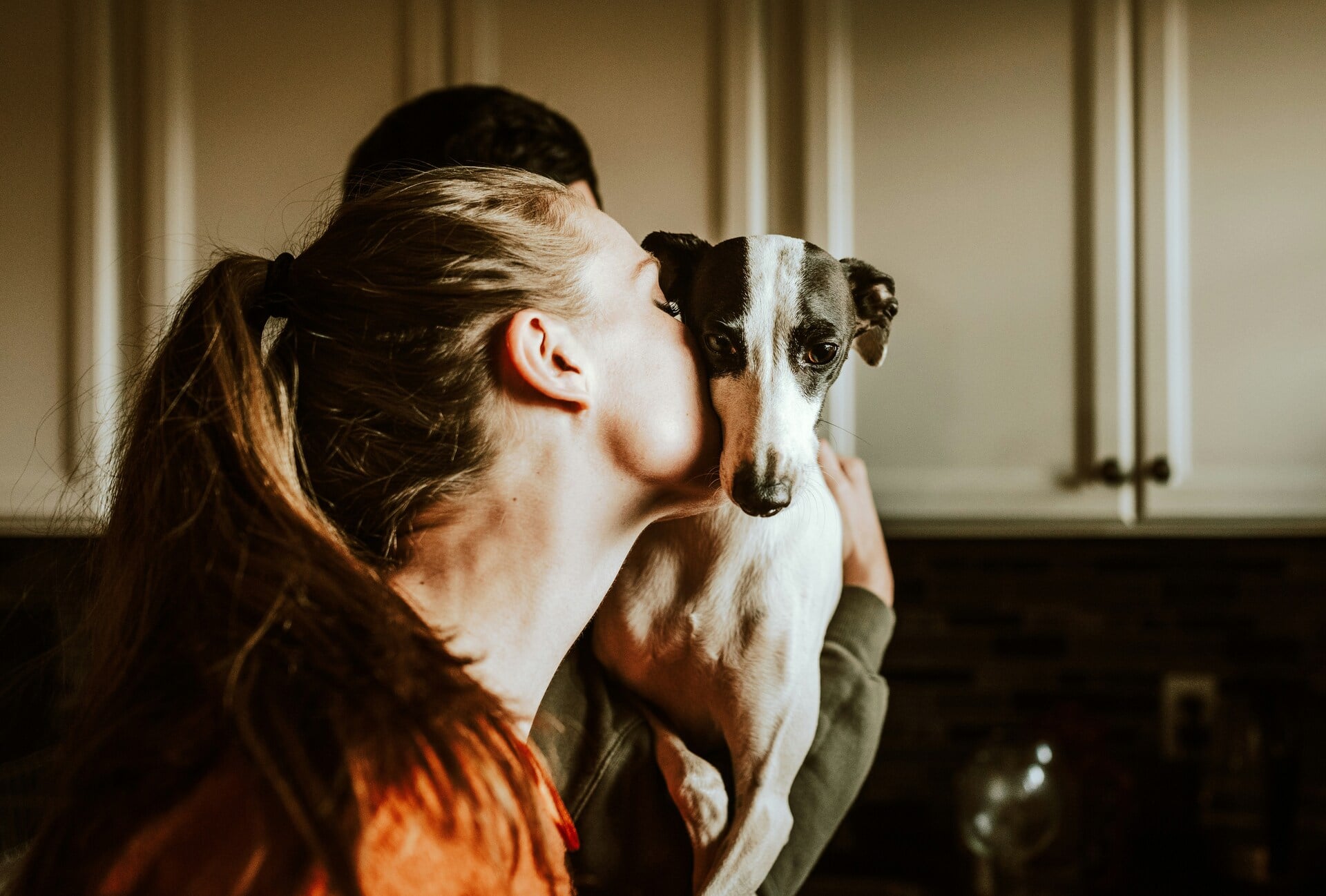 Woman hugging her adopted dog